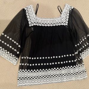 Cute summer boho style top with solid camisole.